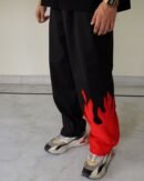 Close-up of flame graphic on The Drip Soul Red Fire Flame Kick Straight Baggy Track Pant highlighting stitching and vibrant print quality.