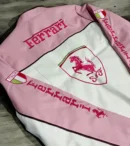 Back view of The Drip Soul Pink Ferrari Leather Racing Jacket showing premium craftsmanship and signature F1 racing stripes
