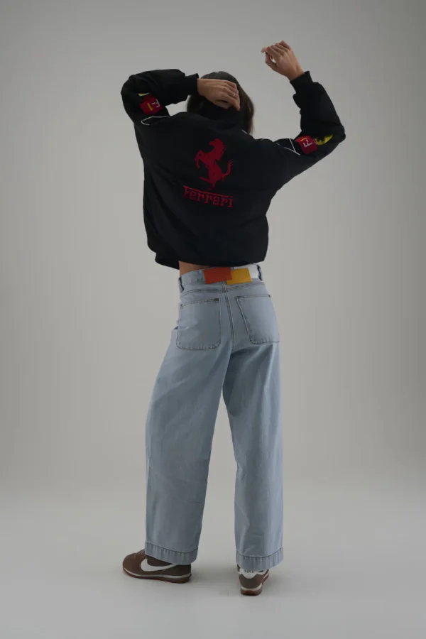 Back of Ferrari F1 Motorsport Jacket with stylish belt and wide-leg jeans