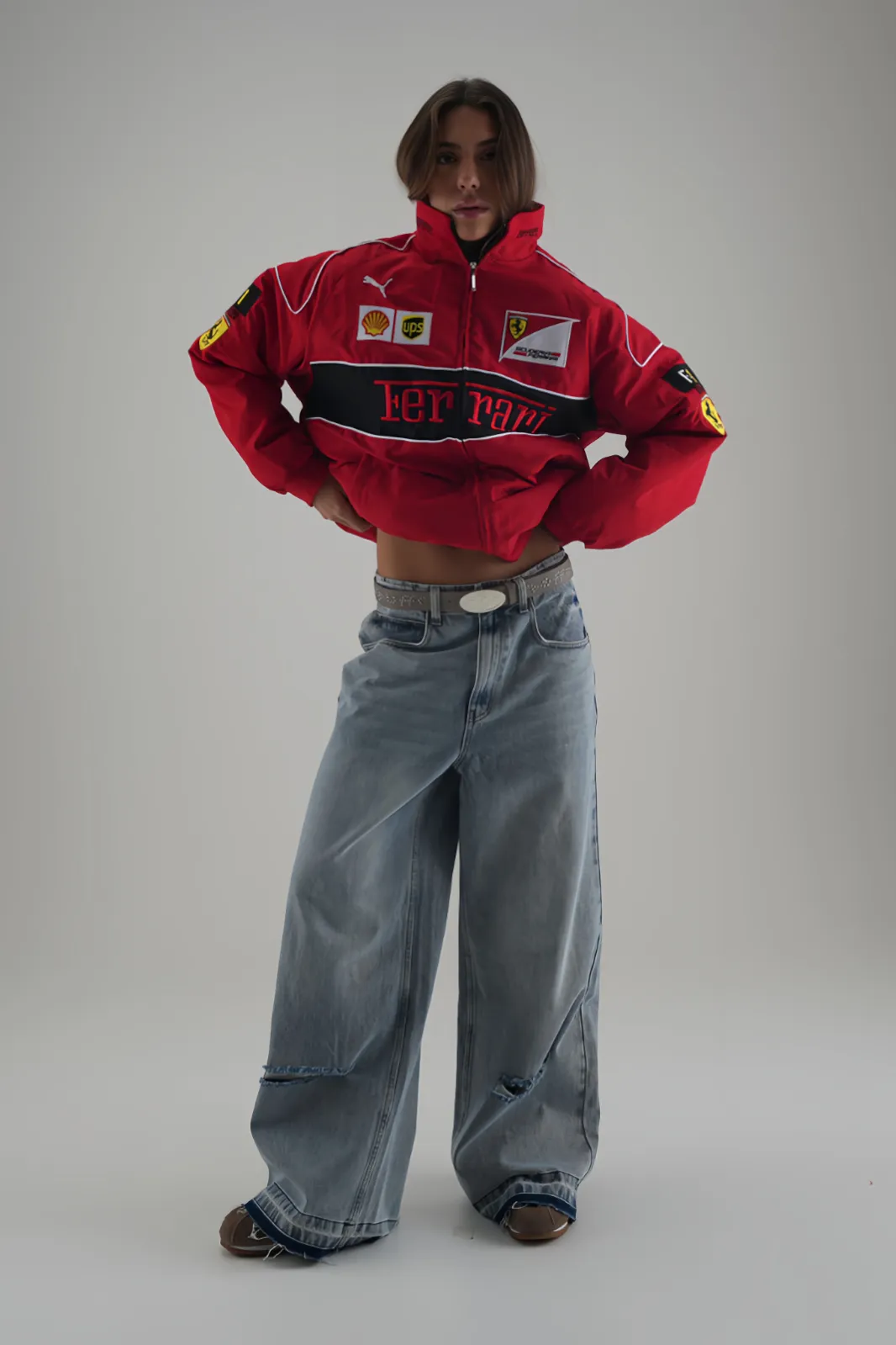 Close-up of the Red & Black F1 Elite Power Racer Jacket, showing sponsor patches.