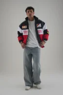 Model wearing oversized Ferrari F1 Racer Jacket and wide-leg denim