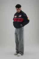 Model wearing Ferrari F1 Vintage Racing Jacket with hands in pockets