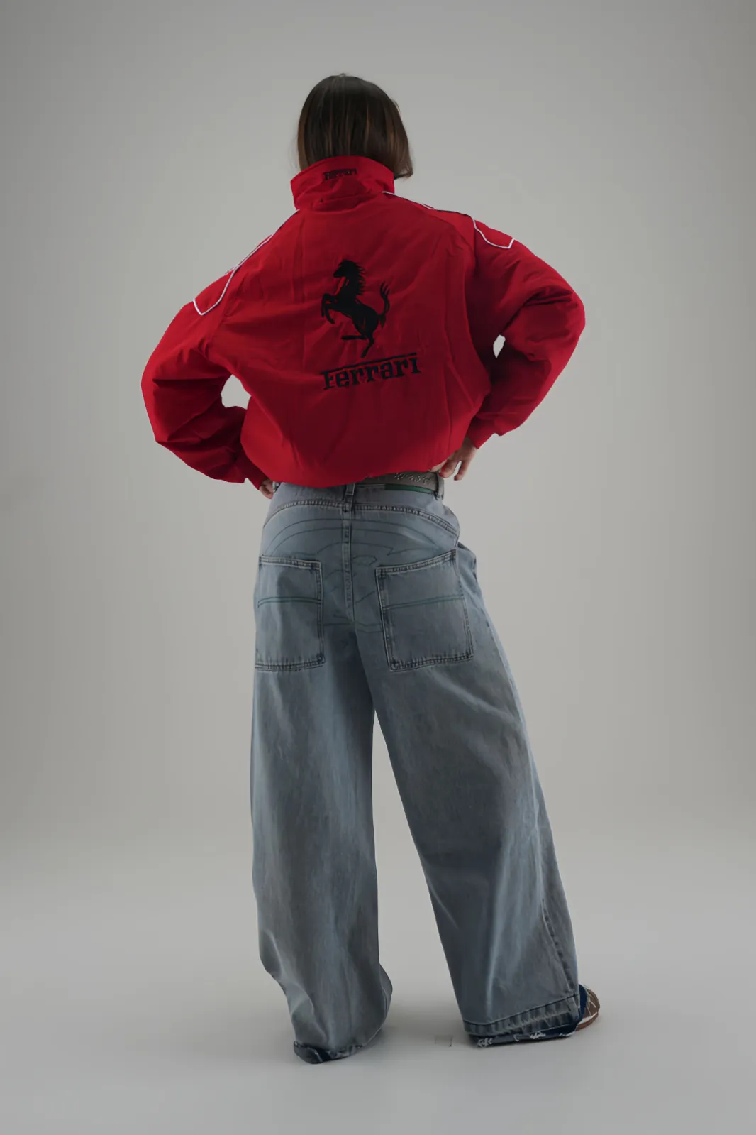 Back close-up of the Red & Black Racing Jacket with large Ferrari horse emblem.