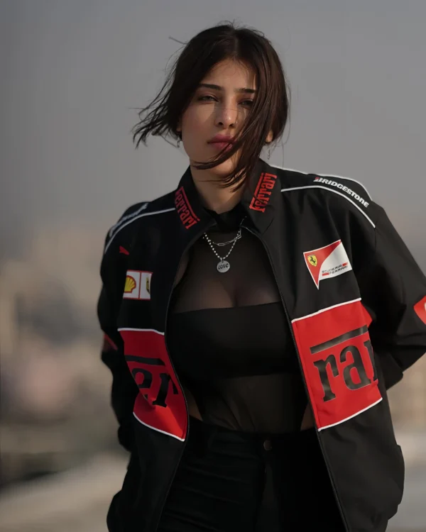 Model wearing Ferrari Racing Heritage Jacket at motorsport event, showing luxury and performance details