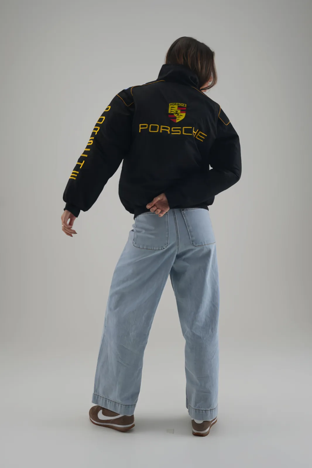 Full length view of the Retro Black & Yellow Porsche Puffer Jacket showing the relaxed fit.
