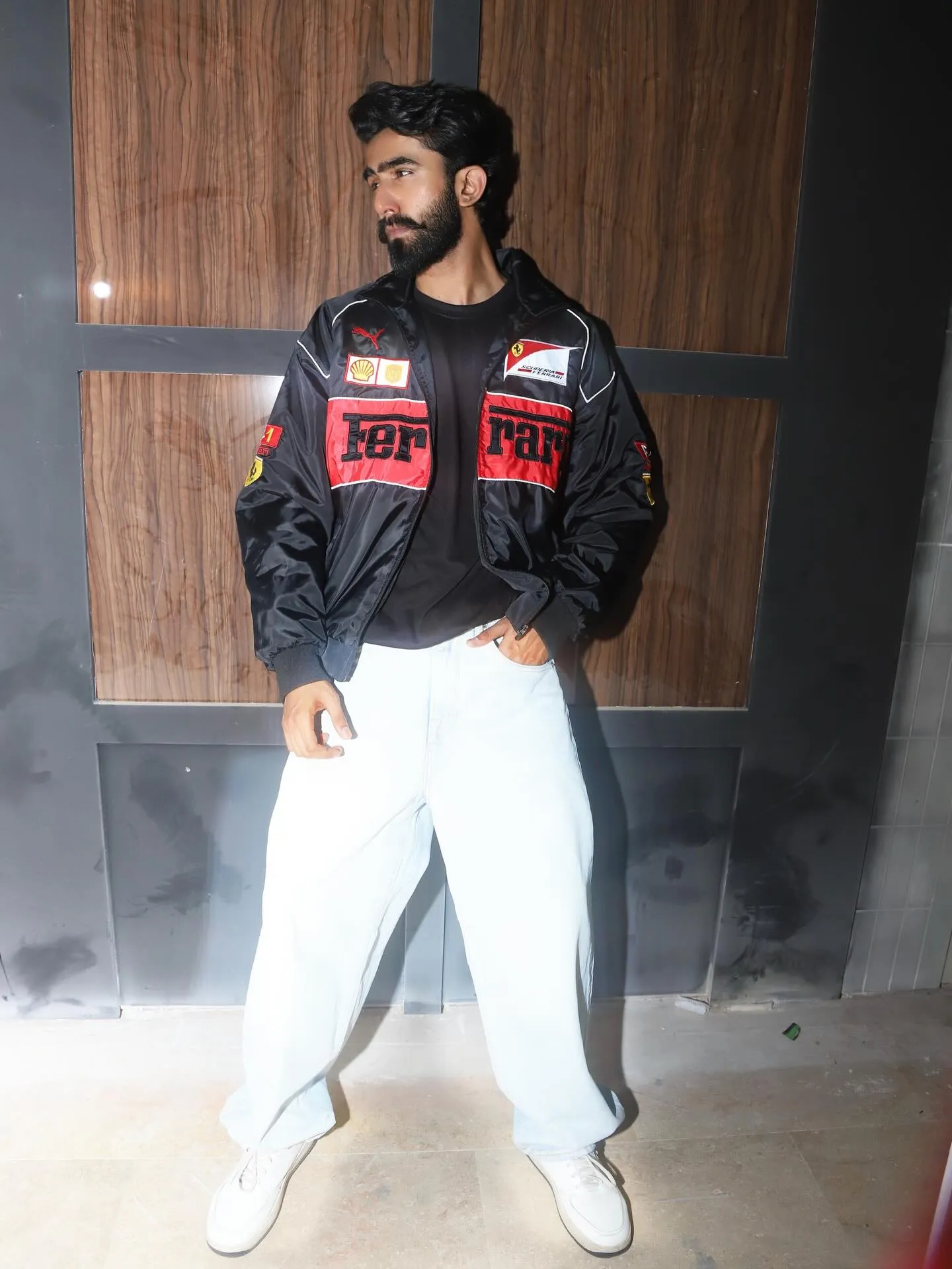 Black Ferrari embroidered jacket styled with jeans and sneakers