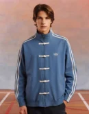 Model Wearing Adidas CNY Jacket by The Drip Soul in blue Color and Showcase traditional knot button and Jacket detailing